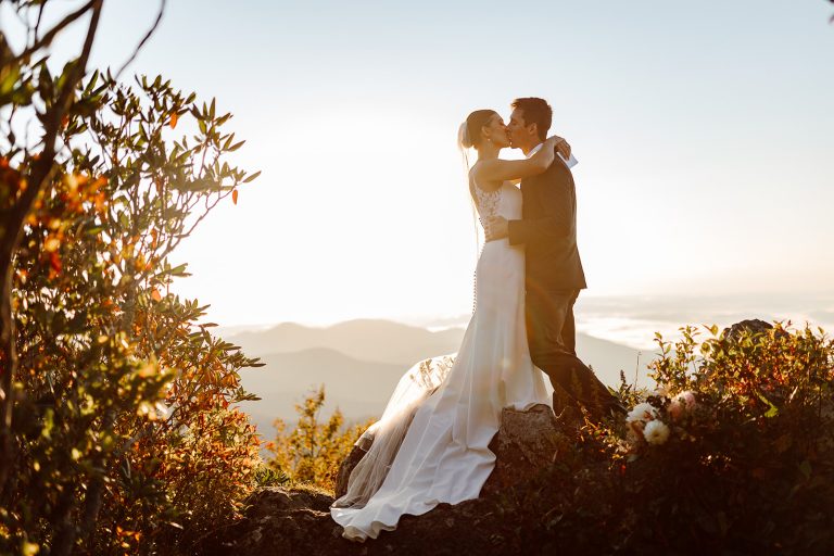 bailey and daniel embrace at sunrise in the blue ridge mountains during their Asheville Elopement photographed by Wilder Weddings Collective